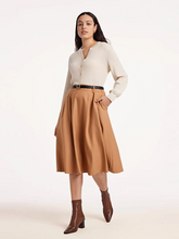 a curvy lady in plus size a-lined skirt with sweater